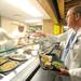 Executive Chef Ryan Kendall, left, hands a plate of food to Dr. Eric Weatley on the opening day of the St. Joe's Market Cafe at St. Joseph Mercy Hospital in Ypsilanti, Mich. on Sept. 6, 2011. Angela J. Cesere | AnnArbor.com